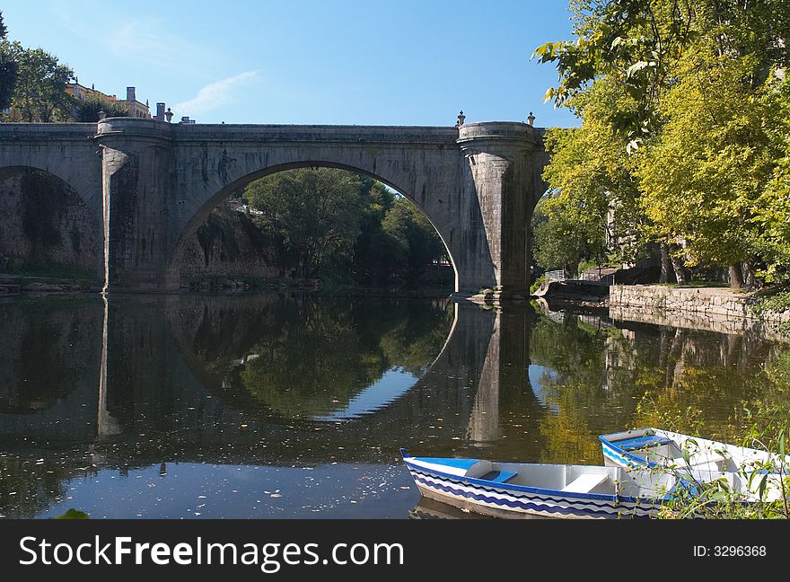 Ponte de Sao Goncalo (old roman style bridge) at Amarante Portugal. Reflection of the bridge in the water. Ponte de Sao Goncalo (old roman style bridge) at Amarante Portugal. Reflection of the bridge in the water.