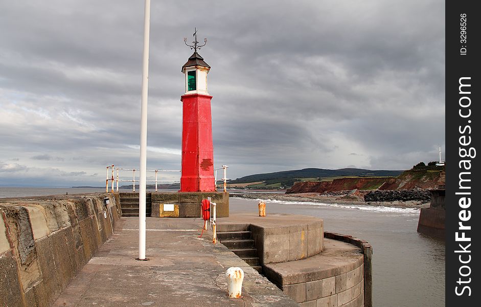 Lighthouse at the entrance to a Harbour on the Somerset Coast in England. Lighthouse at the entrance to a Harbour on the Somerset Coast in England