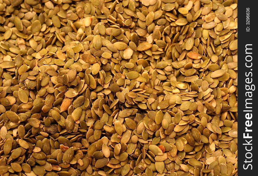 Raw pumpkin seeds on display in a snack shop