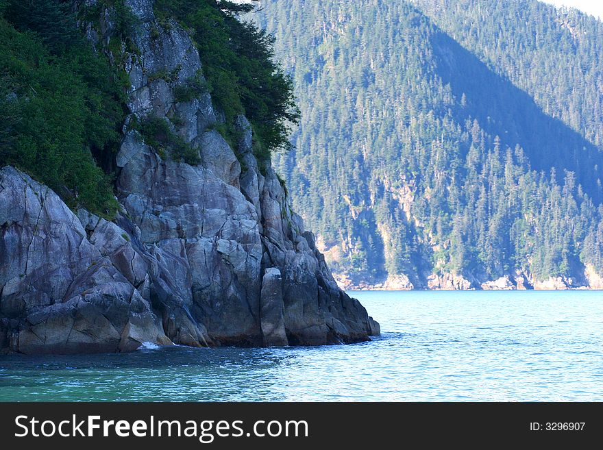 Alaskan shoreline against the sea. Alaskan shoreline against the sea.