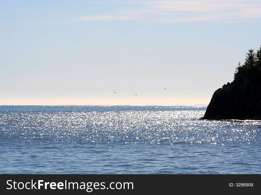 Alaskan shoreline against the sea. Alaskan shoreline against the sea.