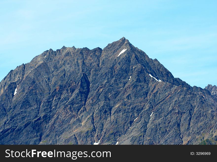 Harsh peaks covered with snow in Alaska. Harsh peaks covered with snow in Alaska