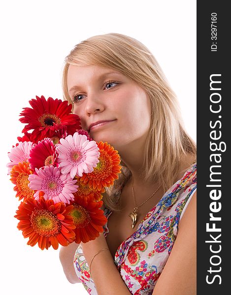 The beautiful blonde holds flowers in hands. The beautiful blonde holds flowers in hands