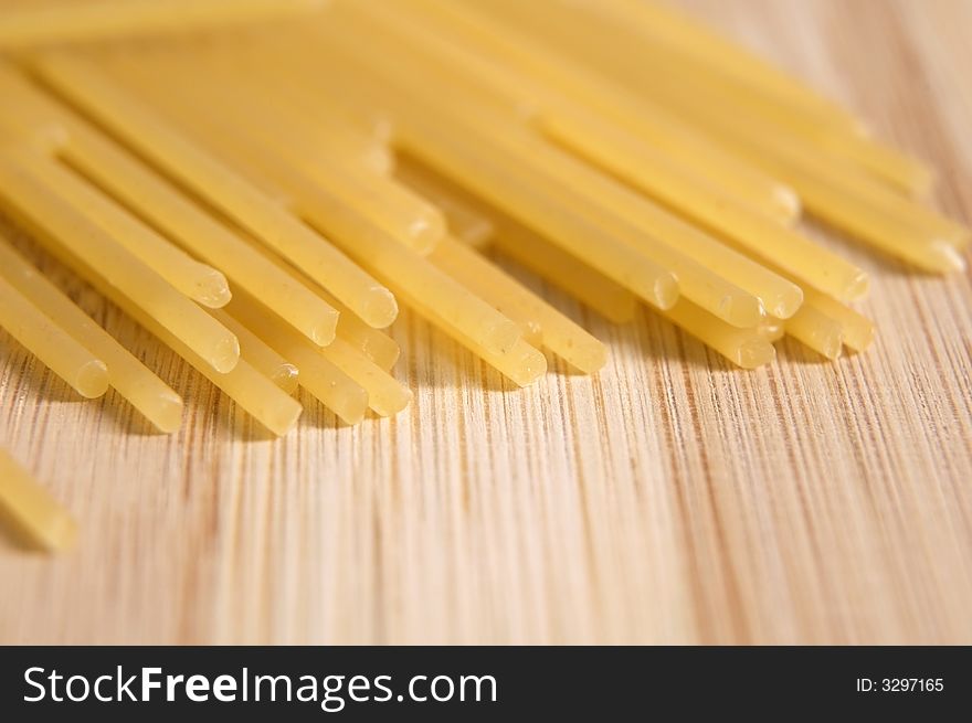 Italian pasta on the wooden cutting board