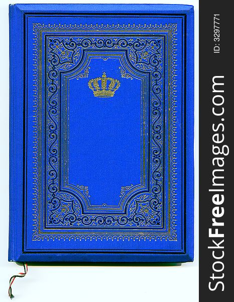 Old ancient deep blue book page with ornaments from 1897 with golden crown