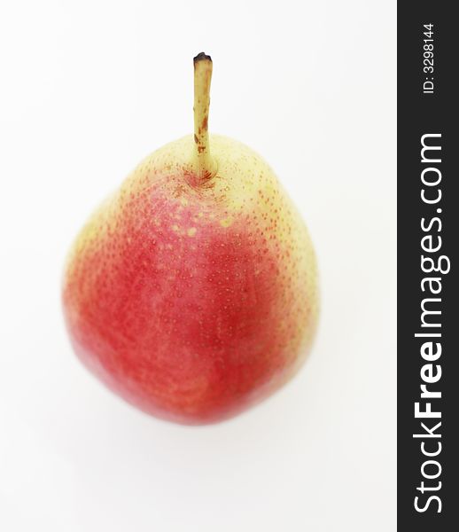 A single ripe English pear against a white background. A single ripe English pear against a white background