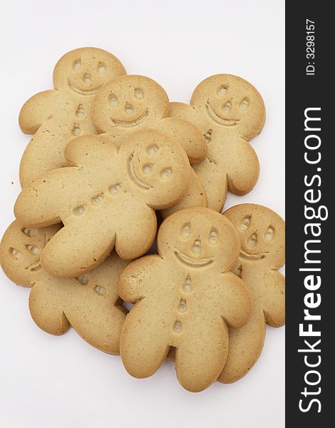 A pile of Gingerbread men against a white background