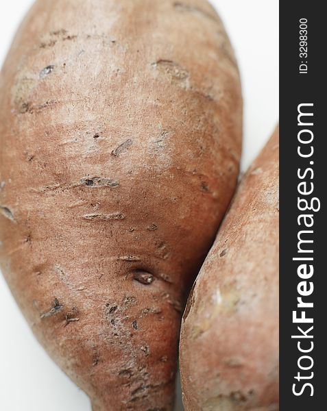 Organic Sweet potato against a white background