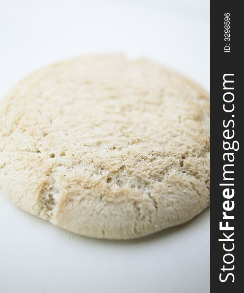 A single Baby rusk biscuit against white background
