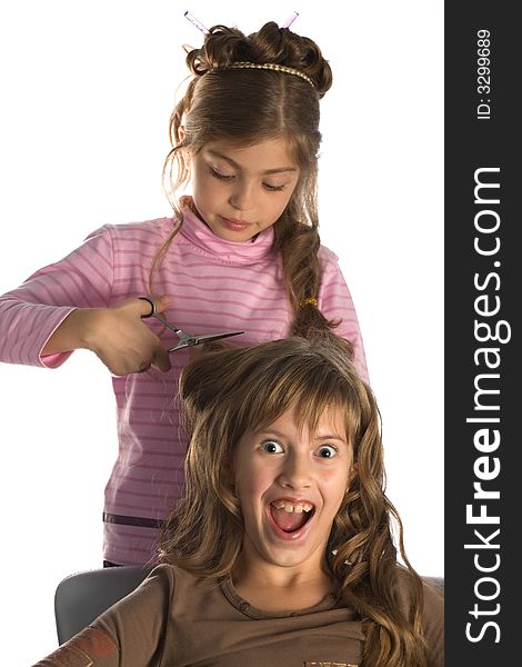 Girl-friends play a hairdressing salon, white background