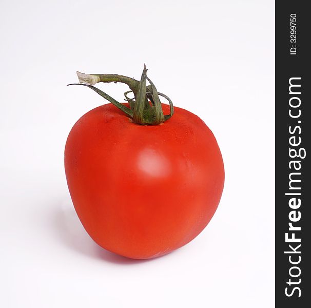 A beautiful ripe juicy red tomato. A beautiful ripe juicy red tomato