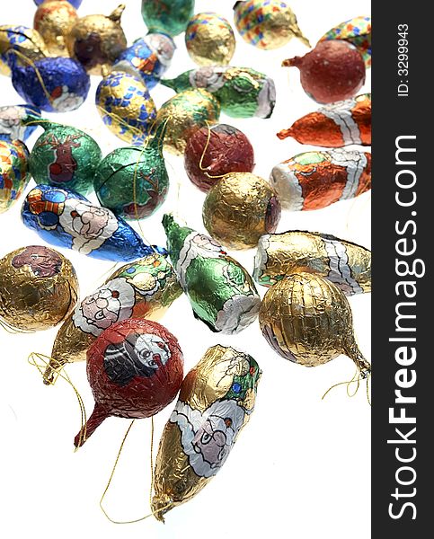 Christmas chocolate decorations against a white background