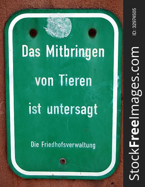 German sign: no animals in cemetery. German sign: no animals in cemetery.