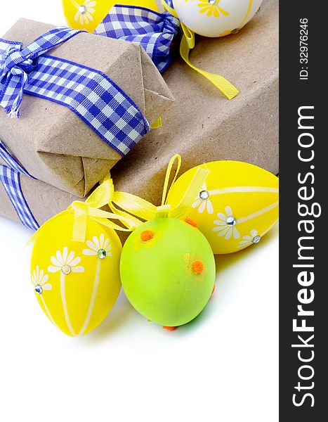 Arrangement of Gift Boxes with Ribbons and Easter Eggs on white background. Arrangement of Gift Boxes with Ribbons and Easter Eggs on white background