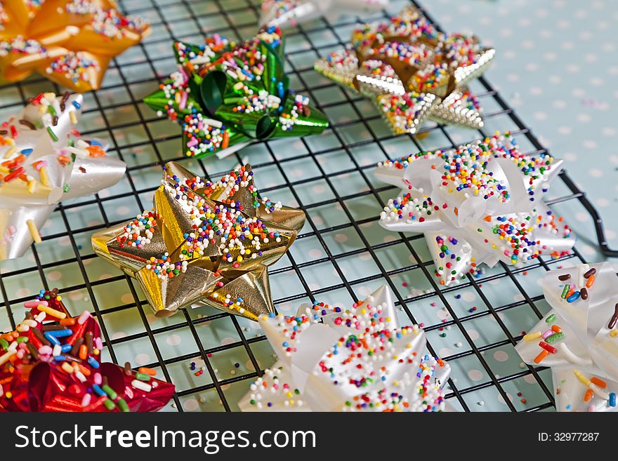 Candy Bows with sprinkles on top a baking rack. Candy Bows with sprinkles on top a baking rack.