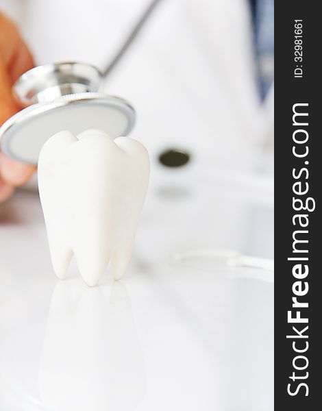 Molar with dentist background ,dental concept