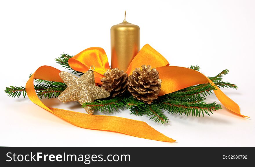 Christmas decoration with the yellow ribbon, cones and candle