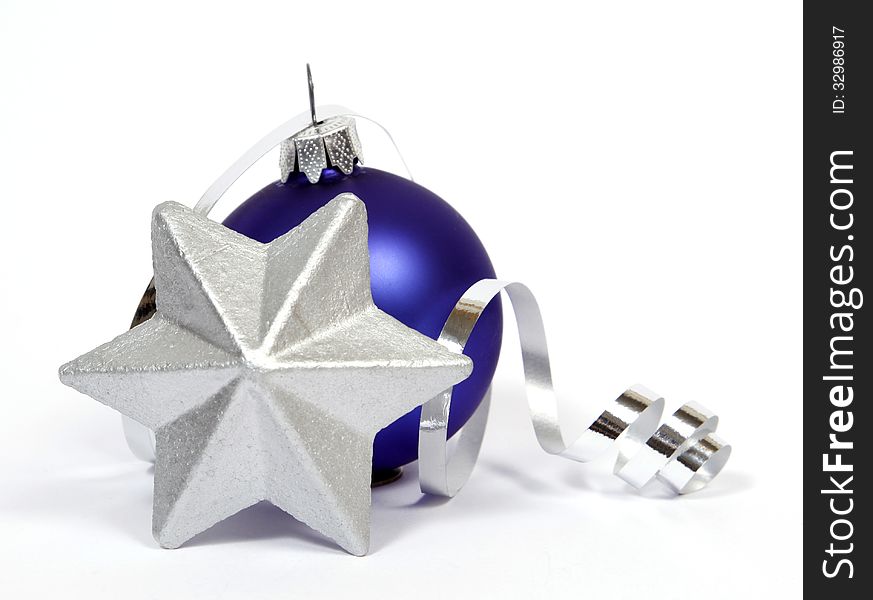 Blue bauble with thesilver star on the white background. Blue bauble with thesilver star on the white background