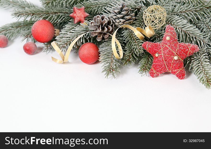 Christmas decoration with the twigs of the spruce and baubles