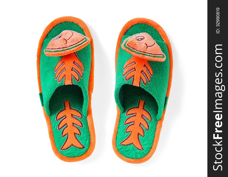 Pair of comfortable slippers with a picture of a funny fish on a white background with clipping path. Pair of comfortable slippers with a picture of a funny fish on a white background with clipping path