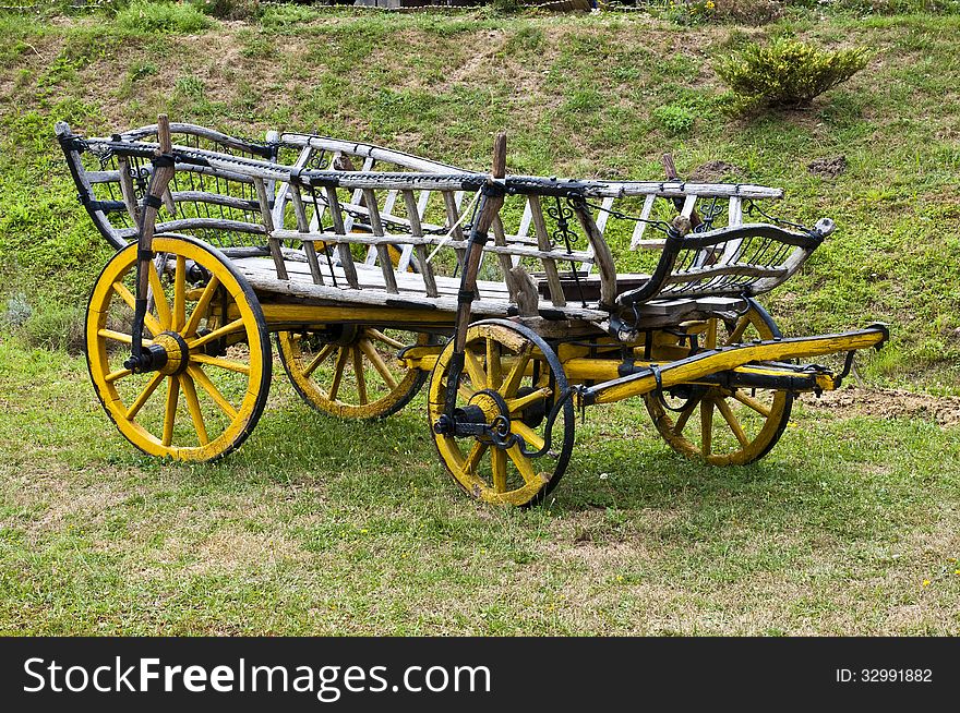 Old wooden carts, placed on the lawn. Old wooden carts, placed on the lawn