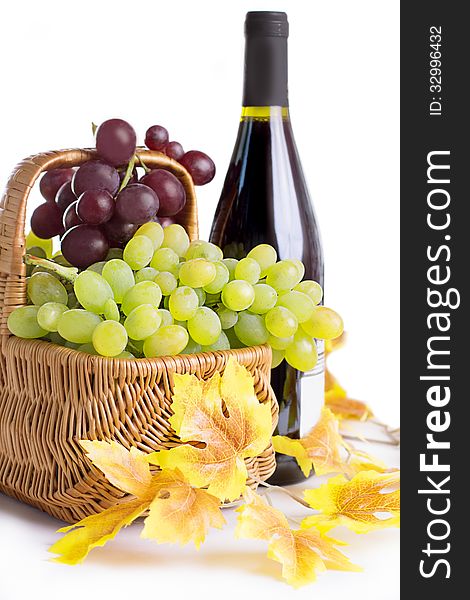 Bottle Of Wine With Grapes In Basket