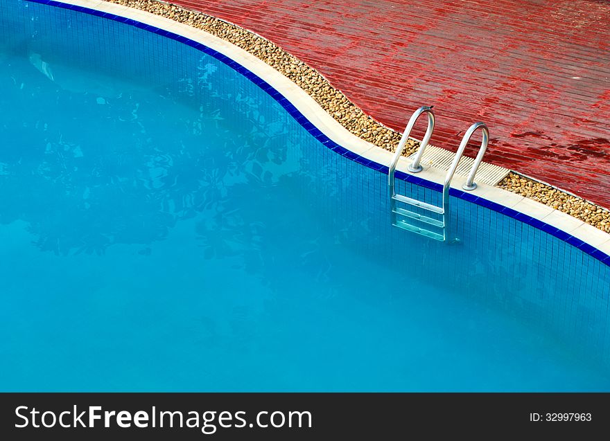 Luxury Resort Swimming Pool high angle on curved edge of a luxury resort swimming pool. Luxury Resort Swimming Pool high angle on curved edge of a luxury resort swimming pool