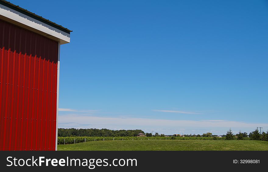 Country landscape view with red barn with siding. Country landscape view with red barn with siding.
