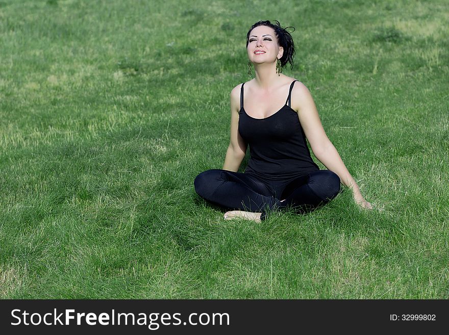 Beautiful girl relaxing in a field. Beautiful girl relaxing in a field