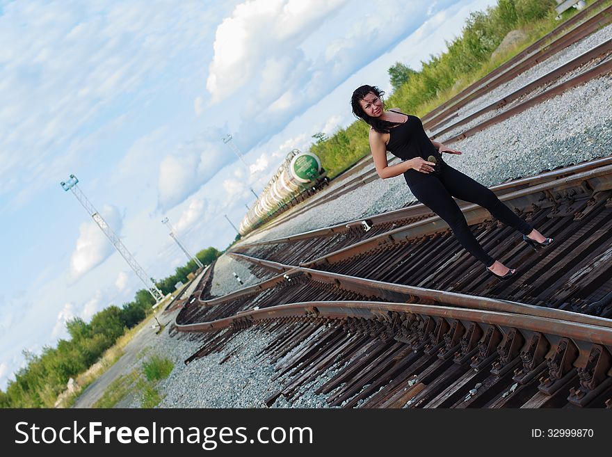 Young woman on a railroad