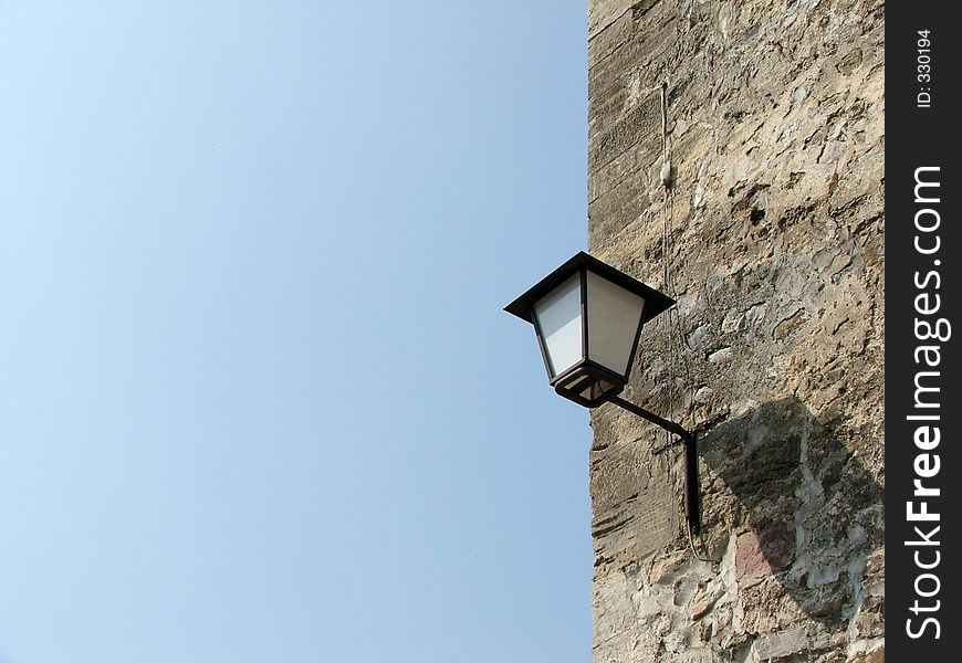 Lamp on the old wall