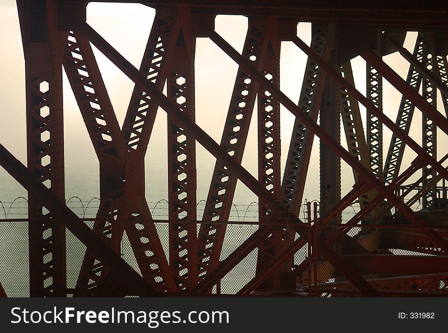 The view from underneath the Famous Golden Gate bridge in California enshrouded in the famous San Francisco fog. The view from underneath the Famous Golden Gate bridge in California enshrouded in the famous San Francisco fog.