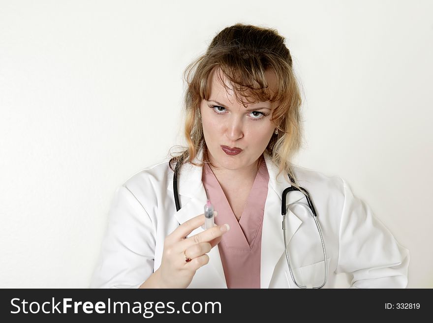 Stern lady doc holding a syringe on white background