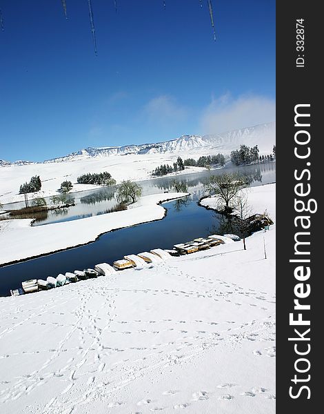 Snow covered lakeside landscape. Snow covered lakeside landscape