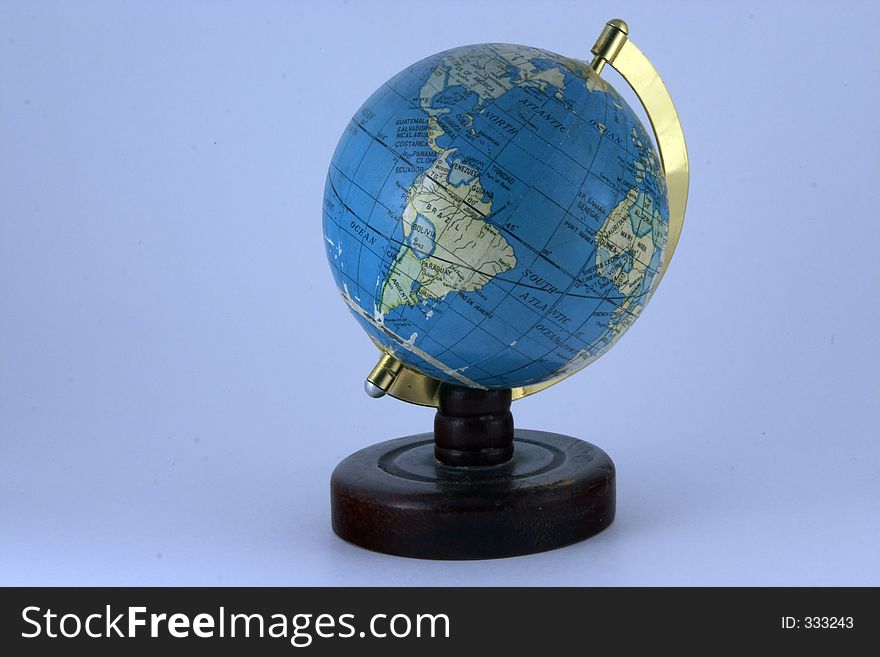 Old style world globe on blue background. Old style world globe on blue background