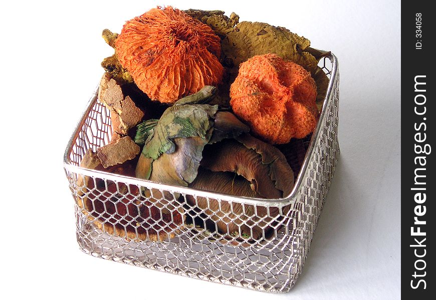 Colorful autumn potpourri in a basket.