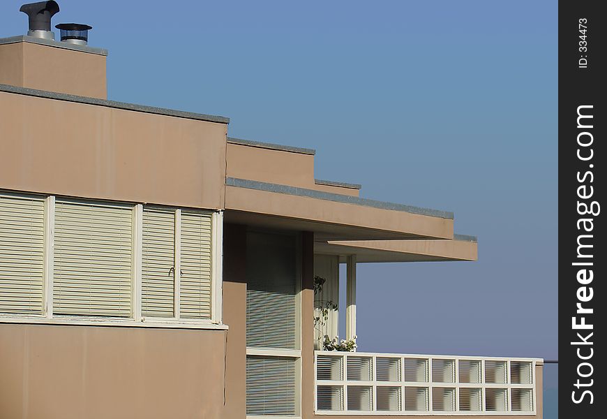 A detail of a 50's modern style apartment building. A detail of a 50's modern style apartment building.