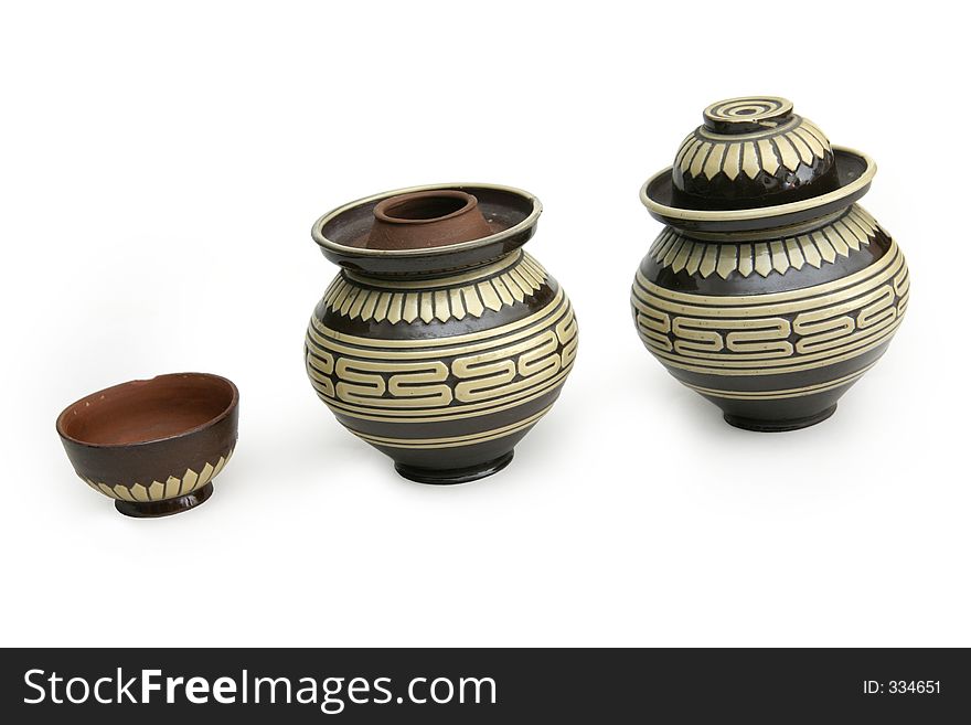 Earthen tea containers where the cap or top of the container can be used as a serving cup. Earthen tea containers where the cap or top of the container can be used as a serving cup