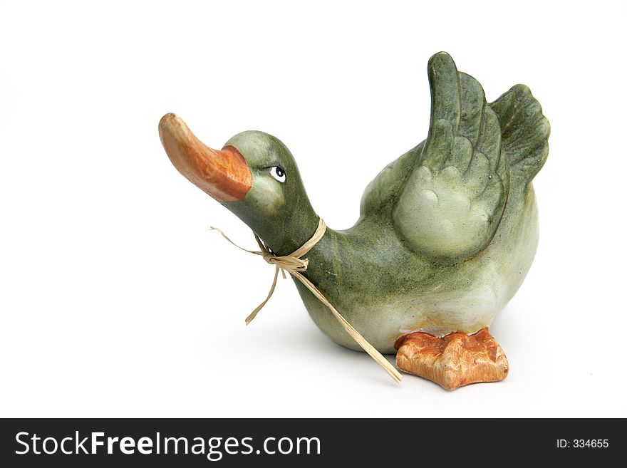 Painted clay duck used as paperweight or decoration