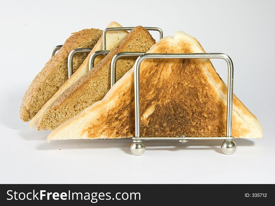 Mixed toast triangles in a rack. Mixed toast triangles in a rack