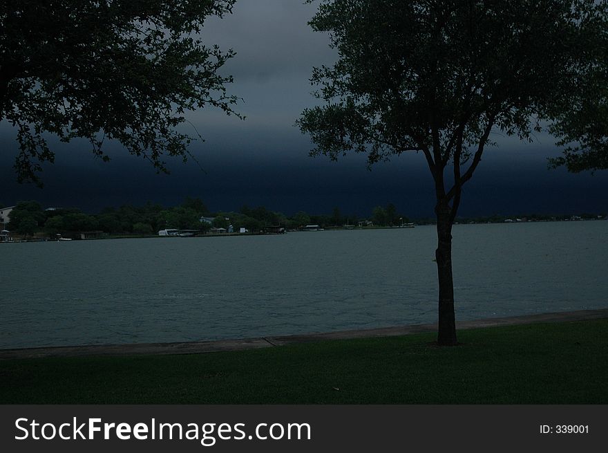 Storm approaches a lake creating dangerous weather conditions. Storm approaches a lake creating dangerous weather conditions.