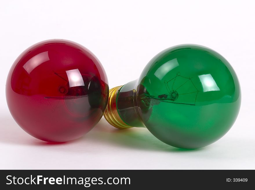 A pair of light bulbs - red and green. A pair of light bulbs - red and green