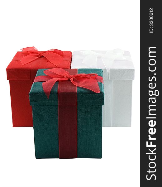 Three Christmas presents isolated on a white background