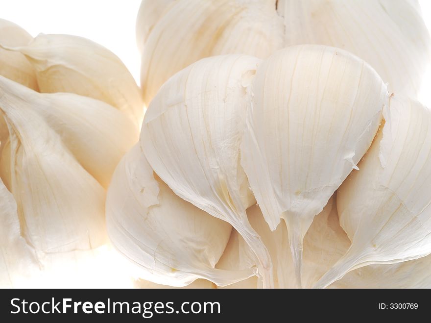 Close-up of garlic on white background