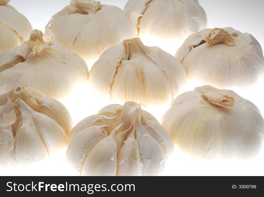 Few garlic on white background