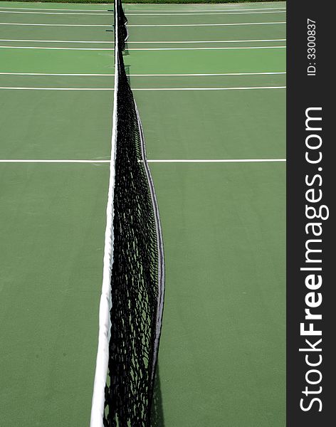 Net In Middle Of Tennis Court