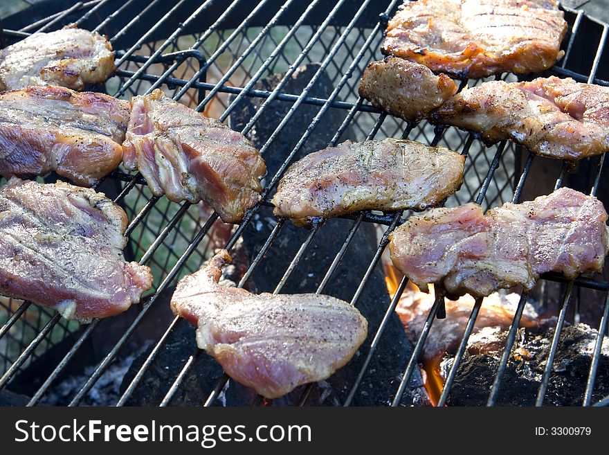 Close up of meat on a grill. Close up of meat on a grill