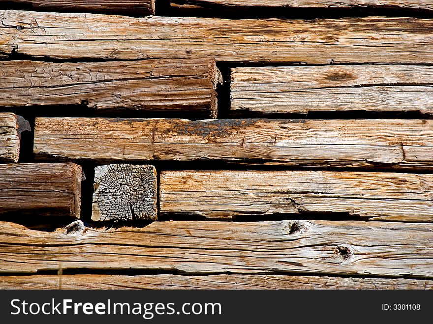 Wooden  beams that make up a wall, shot close up to create a background. Wooden  beams that make up a wall, shot close up to create a background