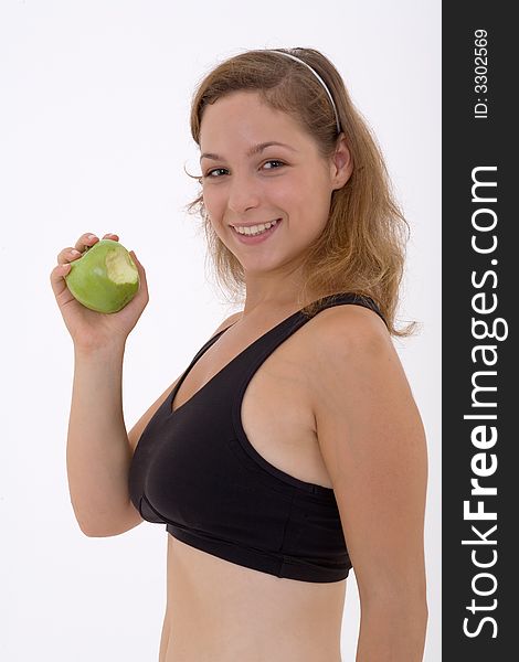 Fitness girl with apple, isolated