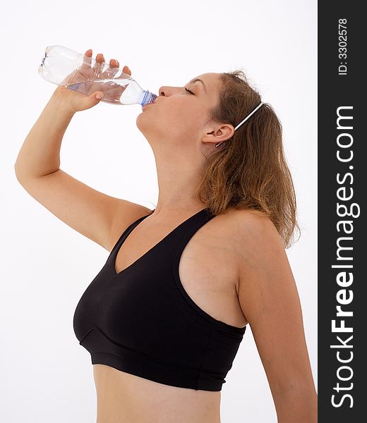 Fitness girl drinking water, isolated